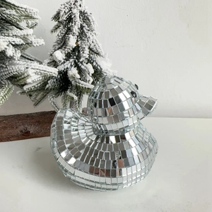 Detailed close-up of disco ball mirror glass duck craft with reflective mosaic tiles