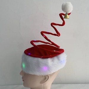 Close-up of spiral Christmas hat with colorful LED lights, red velvet and small gold bell