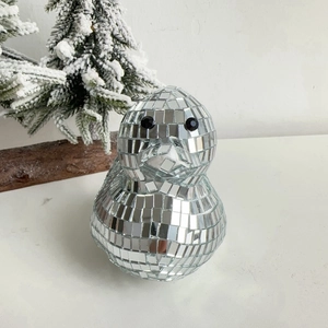 Macro detail of disco ball duck sculpture with reflective silver glass mosaic tiles