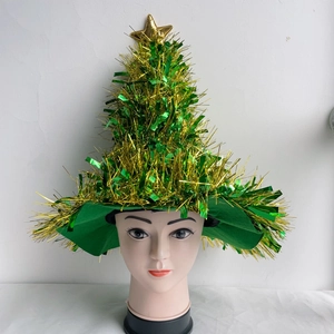 Detail of Christmas tree sequin hat with green and gold sequins and a golden star top