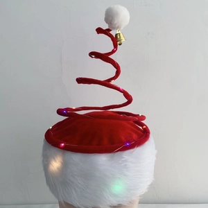 Detail of red spiral Christmas spring hat with LED lights and golden bell ornament