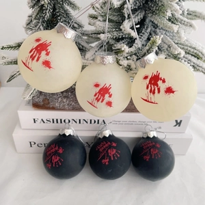 Detail of six Halloween hanging ornaments with red blood handprints and Wanna Play text