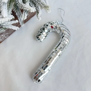 Close-up of a silver disco ball candy cane ornament with reflective mirror mosaic tiles