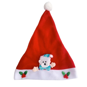Detail of red Christmas hat with white plush trim and cute 3D polar bear ornament