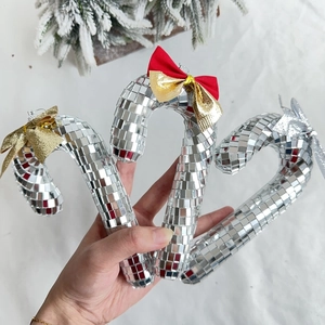 Disco mirror ball candy cane Christmas ornaments with festive gold and red bows