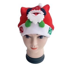 Detail showing plush red Christmas hat with 3D Santa Claus and HO HO embroidery