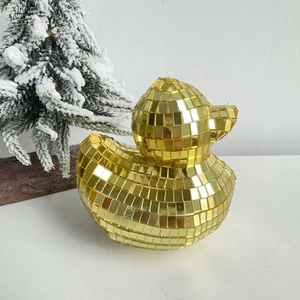 Detailed view of golden disco ball mirror mosaic duck figurine for home decor