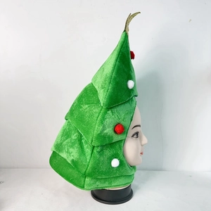 Detail view of the green plush Christmas tree hat featuring colorful pom-pom ornaments