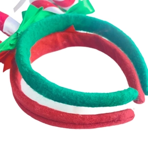 Detail of Christmas headbands set featuring red and green felt with candy cane decor