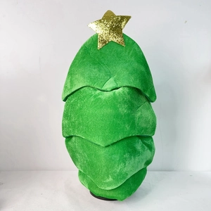 Detail of green plush Christmas tree hat with golden sequin star on top
