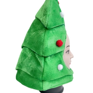 Christmas tree shaped party hat in green plush with red and white pompom decorations
