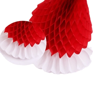 Detail of red and white honeycomb paper Christmas tree ornament with layered texture