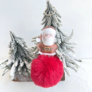 Christmas Santa Claus keychain with plush red faux rabbit fur ball and festive decor