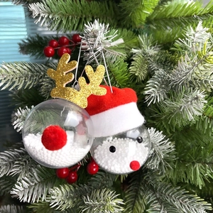 Christmas transparent balls with reindeer and Santa designs on pine branches