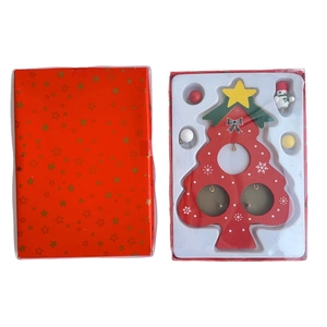 Detail of DIY wooden Christmas tree set with ornaments and red gift box packaging