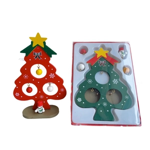 Detail of DIY wooden mini Christmas tree with snowman figurine and blister card packaging