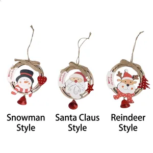 Three hollow wooden Christmas ornaments with Santa, Snowman, and Reindeer motifs and bells