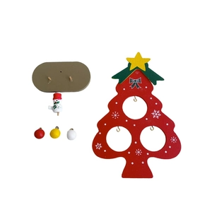 Detail view of mini wooden DIY Christmas tree set with snowman and ornaments