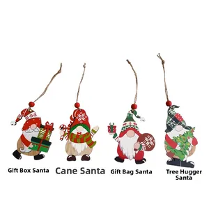 Detail of four Christmas wooden gnomes with gift box, candy cane, parcel and tree