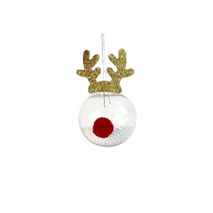 Détail d'une boule de Noël disco avec bois de renne dorés et pompon rouge décoratif
