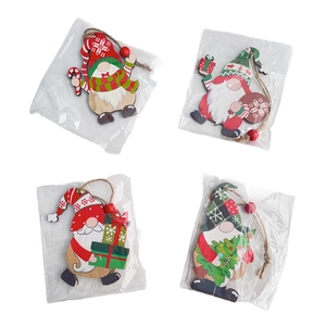 Detailed view of four painted wooden Christmas gnome ornaments with hanging jute strings