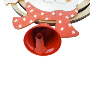 Close-up of a red metal bell and wooden reindeer ornament with a star pattern scarf