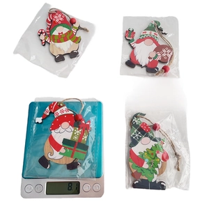 Detail of four painted Christmas gnome wood ornaments with red beads and twine hangers