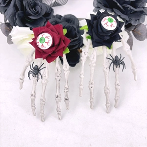 Pinces à cheveux squelette avec roses rouges, araignées noires et yeux sanglants