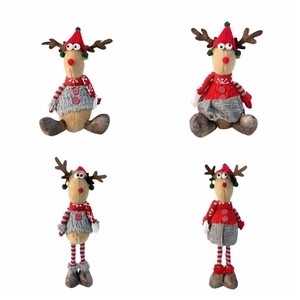 Detail view of four Christmas reindeer plush toys with knit sweaters and snowflake hats