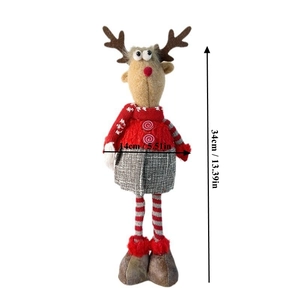 Detailed size chart showing height 34cm and width 14cm of Christmas reindeer doll