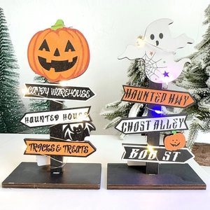 Detail of wooden Halloween LED decorations with pumpkin and ghost themes for parties