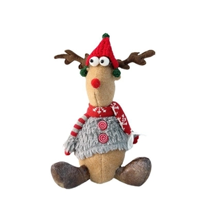 Close-up of Christmas reindeer plush doll wearing a red knit hat and grey sweater