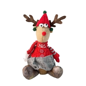 Detailed view of Christmas reindeer doll wearing knit hat and snowflake sweater