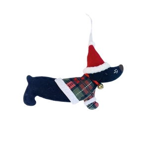 Macro detail of felt dachshund ornament with plaid sweater and gold bell for Christmas decoration