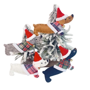 Detail view of four felt dachshund dog Christmas ornaments with sweaters and hats