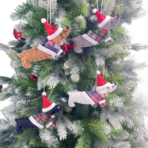 Felt dachshund Christmas tree ornaments with mini Santa hats and knitted plaid sweaters