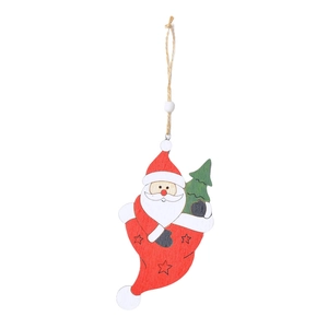 Detail of wooden Christmas boot ornament with Santa Claus and a green pine tree