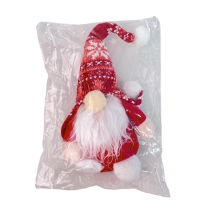 Gnomo natalizio in peluche con cappello a maglia rosso e bianco in busta di plastica