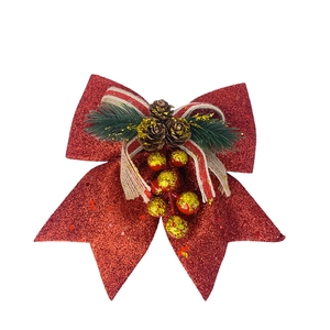 Detail of red glitter Christmas bow with natural pine cones and green needles
