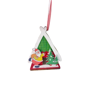 Close-up of a white wooden Christmas cabin ornament with Santa Claus and red ribbon