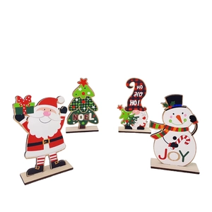 Set of 4 Christmas wooden tabletop decorations with Santa, Snowman, and Noel motifs
