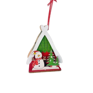 Detail of wooden Christmas tree ornament with snowman and green pine trees on red base