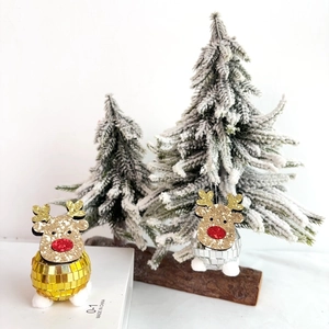 Disco ball reindeer Christmas ornaments in gold and silver with sparkling glitter accents
