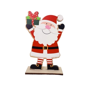 Detail of wooden Santa Claus desktop ornament with gift box and laser-cut edges