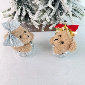 Detail of plush Christmas bear ornaments with sequin bows and mosaic disco mirror bases