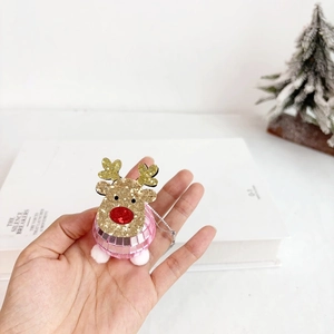 Detailed view of reindeer disco ball ornament with golden sequins and pink mirror finish