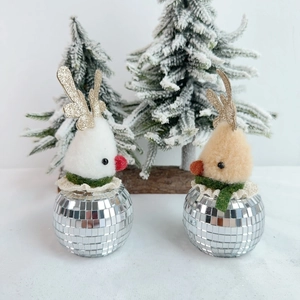 Christmas reindeer figurines with silver disco mirror bases in white and camel colors