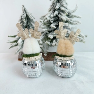 Close-up of reindeer disco ball ornaments with reflective glass tiles and gold antlers