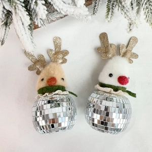 Close-up of sparkling mirror disco ball deer ornaments with glitter antlers and cozy scarves