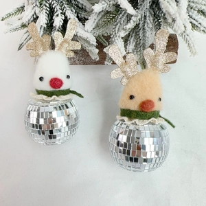 Close-up of reindeer disco ball ornaments with wool felt heads and gold glitter antlers